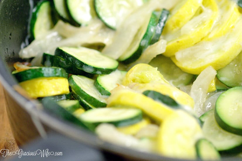 Sauteed Squash and Zucchini Recipe - an easy summer vegetable side dish recipe.  A combination of summer squash, zucchini, sweet onions, and garlic, quickly sauteed together and topped with cheese for a fast and delicious summer side dish.  This is one of my Summer favorites! It's even better when the sauteed squash and zucchini are fresh from the garden!