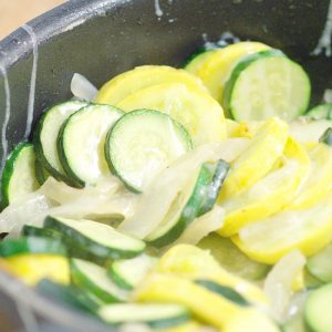 Sauteed Squash and Zucchini Recipe - an easy summer vegetable side dish recipe.  A combination of summer squash, zucchini, sweet onions, and garlic, quickly sauteed together and topped with cheese for a fast and delicious summer side dish.  This is one of my Summer favorites! It's even better when the sauteed squash and zucchini are fresh from the garden!