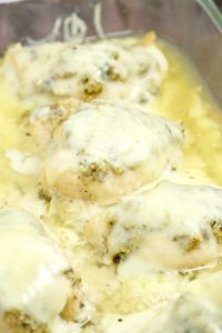 Cheesy Garlic Herb Chicken - easy and cheesy baked chicken dinner recipe with lots of herbs and garlic, and best of all gooey CHEESE!  