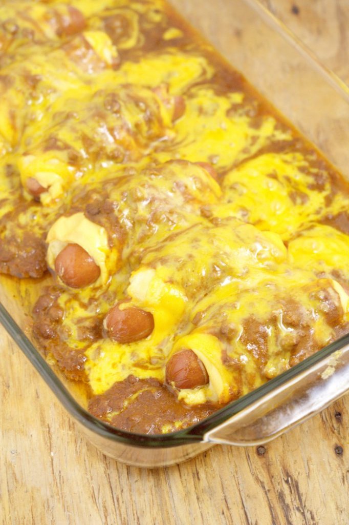 Chili Cheese Dog Casserole Recipe- A quick and easy family dinner idea recipe inspired by chili cheese dogs combined with the comfort and ease of a casserole. OMG. So cheesy!