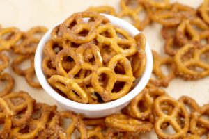Cinnamon Sugar Pretzels Recipe- salty pretzels baked in butter, cinnamon, and sugar. A super yummy appetizer and snack recipe, great for a party, the holidays, or just because! The perfect combination of sweet and salty! 