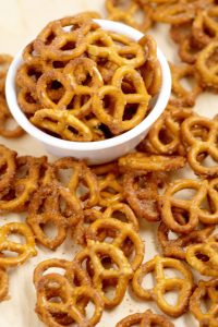 Cinnamon Sugar Pretzels Recipe- salty pretzels baked in butter, cinnamon, and sugar. A super yummy appetizer and snack recipe, great for a party, the holidays, or just because! The perfect combination of sweet and salty!