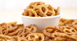 Cinnamon Sugar Pretzels Recipe- salty pretzels baked in butter, cinnamon, and sugar. A super yummy appetizer and snack recipe, great for a party, the holidays, or just because! The perfect combination of sweet and salty!