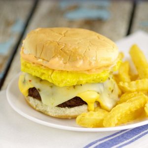 Pineapple Teriyaki Burgers recipe - Traditional juicy hamburgers featuring a sweet pineapple topping with tangy Teriyaki sauce right in the burger. Top with lots of gooey cheese! Super yummy Summer grill, cookout, or BBQ idea!