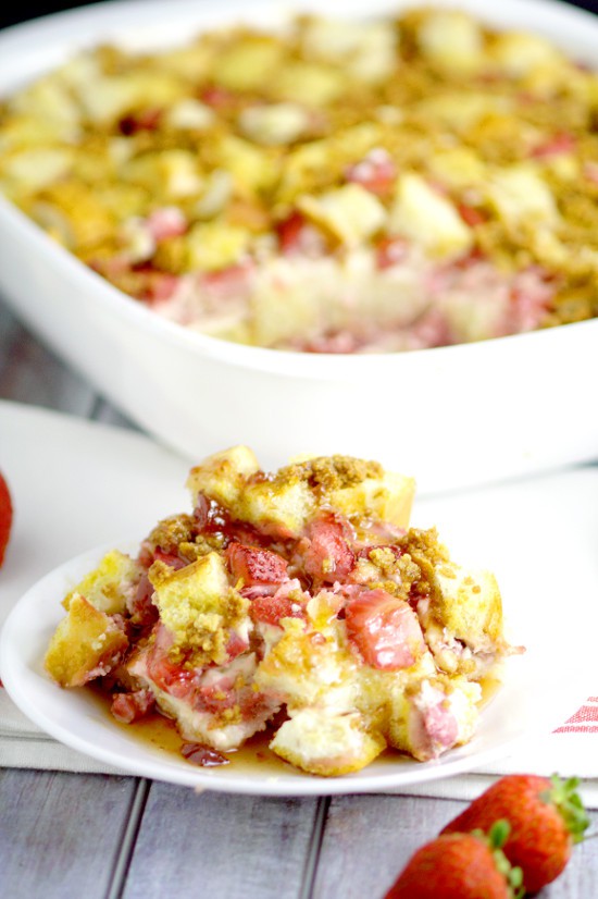 Have cheesecake for breakfast with Strawberry Cream Cheese French Toast Bake! Filled with fresh strawberries, creamy cheesecake spread, and a graham cracker topping! A delicious overnight, make ahead breakfast casserole recipe that's great for the holidays, Christmas, and busy mornings!