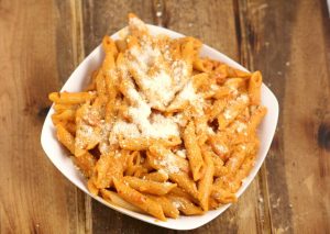 Creamy Tomato Penne Pasta - a quick and easy pasta recipe perfect for family dinner.  Creamy tomato sauce with sauteed garlic and a hint of spicy smothering penne noodles for a quick, easy, and amazingly delicious dinner.  This is seriously one of my favorites. I craved this All. The. Time. the last time I was pregnant.