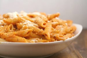 Creamy Tomato Penne Pasta - a quick and easy pasta recipe perfect for family dinner.  Creamy tomato sauce with sauteed garlic and a hint of spicy smothering penne noodles for a quick, easy, and amazingly delicious dinner.  This is seriously one of my favorites. I craved this All. The. Time. the last time I was pregnant.