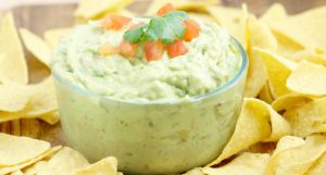 Creamy Guacamole - The perfect dip recipe for chips! Easy guacamole with extra creaminess. Great for a party or football games!