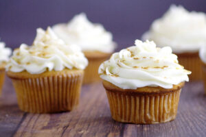 Ginger Brown Sugar Cupcakes with Spiced Cream Cheese Icing- A homemade delightful twist on traditional carrot cake and spice cake cupcakes recipe from scratch. A great dessert for Fall gatherings! Loooove the spiced cream cheese frosting!