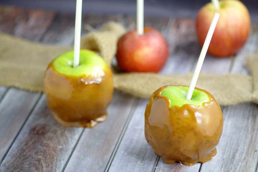 Homemade Taffy Apples are a perfect Fall treat with homemade, gooey and sweet caramel wrapped around fresh, tart apples that the whole family will love.  Caramel Apples from scratch are amazing! Love this for a Fall dessert recipe.