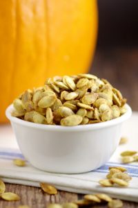 Don't throw out your pumpkin seeds! Toasted Pumpkin Seeds are a delicious and easy snack. You can make this buttery, salty goodness right in your oven! Perfect savory treat for Halloween!