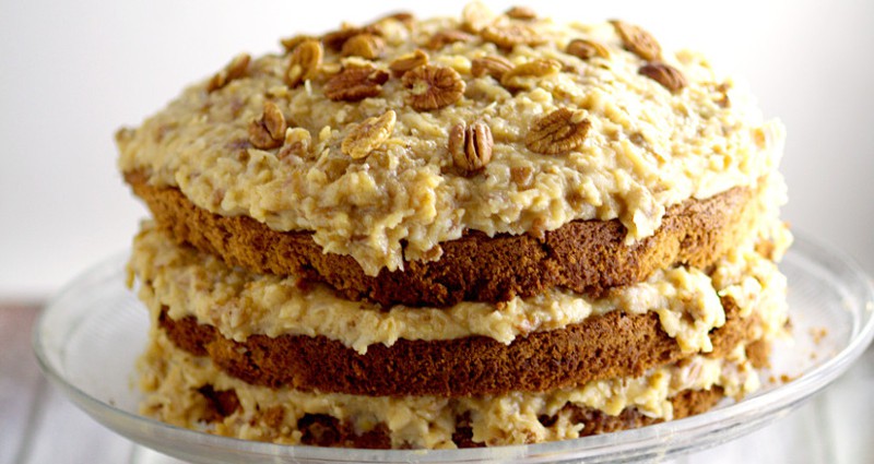 A traditional German Chocolate Cake Recipe made from scrath with sweet German chocolate and topped with a caramel-y coconut pecan frosting. One of our family favorites! I make this every year for my husband's birthday!