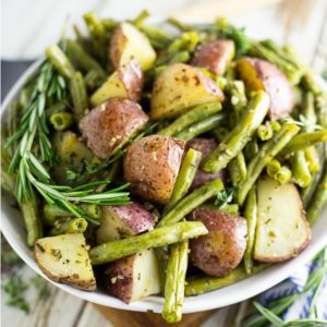 Buttery, crispy red potatoes and fresh green beans tossed with garlic and herbs make these Garlic Herb Roasted Potatoes and Green Beans a simple, elegant, and flavorful side dish for any meal.