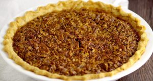 Southern Brown Sugar Pecan Pie- A super simple but absolutely delicious Southern Pecan Pie recipe. I make these for the holidays every year, and they are amazing! A gooey, caramel-like filling is topped with crunchy pecans, all in a perfect, flaky pie crust.