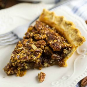 Gooey caramel filling with crunchy pecans in a buttery, flaky, golden crust make this homemade Southern Pecan Pie a heavenly treat for your holiday table! This recipe is SO EASY to make and seriously the best pecan pie ever. Plus video directions!