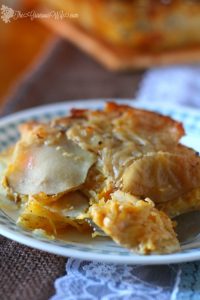 This Butternut Squash Gratin is a delicious and unique variation to your traditional gratin potatoes, featuring squash and Gouda.  Perfect for a Thanksgiving side dish recipe.  From TheGraciousWife.com #Thanksgiving #sidedishes