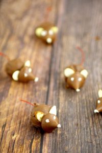 These fun Chocolate Cherry Christmas Mice made from chocolate covered cherries with almond slices and Kisses, are adorable Christmas candy treats recipe and a great addition to your dessert table. These will be so cute next to all the Christmas cookies!