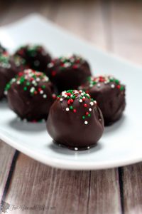 Peanut Butter Chocolate Truffles with creamy, salty peanut butter covered in decadent chocolate and festive sprinkles will be the hit at your Christmas party. This easy homemade Christmas truffles recipe is great for a Christmas cookies exchange. Mmmm.... Must try for all Reese's lovers!