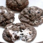 Marshmallow Oreo Chip Cookies are a sort of everything-but-the-kitchen-sink chocolate cookie recipe with gooey, sticky marshmallows, Oreos, and Cookies 'N Cream Bars. Made with pudding mix these cookies are very moist and soft.  These would be great to try out for a Christmas Cookie recipe this year!