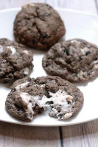 Marshmallow Oreo Chip Cookies are a sort of everything-but-the-kitchen-sink chocolate cookie recipe with gooey, sticky marshmallows, Oreos, and Cookies 'N Cream Bars. Made with pudding mix these cookies are very moist and soft.  These would be great to try out for a Christmas Cookie recipe this year!