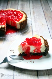 Gingersnap Cherry Cheesecake recipe has a buttery gingersnap crumb crust, classic and creamy cheesecake filling, and a sweet cherry sauce topping, perfect for the holidays. What a beautiful Christmas dessert recipe idea! I looove the sweet maraschino cherry sauce!