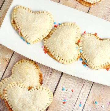 Mini Heart Pies Recipe - an easy dessert pie treat recipe idea. Heart-shaped pies  filled with preserves or apple butter make an adorable treat for your sweetheart. Cute for a Valentines Day treat for kids or a party! 