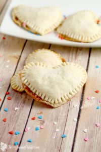 Mini Heart Pies Recipe - an easy dessert pie treat recipe idea. Heart-shaped pies  filled with preserves or apple butter make an adorable treat for your sweetheart. Cute for a Valentines Day treat for kids or a party! 