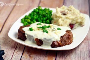 Steak with Creamy Gorgonzola Sauce Recipe- Buttered, seasoned steak smothered in a rich creamy Gorgonzola Sauce. Perfect for a date night in! Or really anytime you're cooking steaks because seriously, the gorgonzola sauce is amazing!