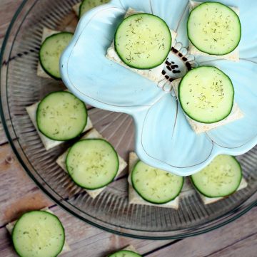 Cucumber Sandwiches Recipe- Perfect for a quick and easy snack or appetizer recipe. Creamy ranch spread and crisp, fresh cucumbers with dill on thin bread squares make a simple but delicious appetizer. These are my favorite! I love these for a party or shower!