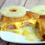 Hawaiian Grilled Cheese Sandwich is the perfect combination of sweet pineapple, salty ham, and gooey cheese. A fun and delicious twist on an American classic. A super easy recipe that's perfect for a quick dinner or an easy lunch. Yummy! Love sweet and salty together!