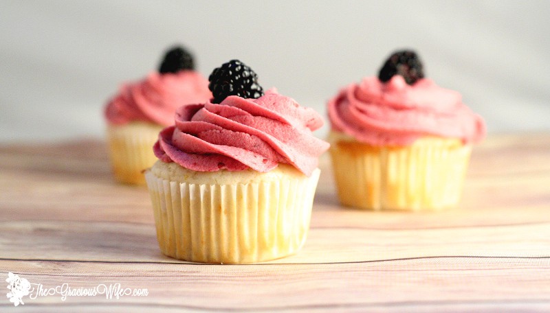 Lemon Cupcakes topped with a blackberry buttercream. From TheGraciousWife.com #lemon #cupcakes #recipe #buttercream