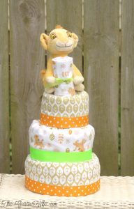 DIY Lion King Faux Fondant Diaper Cake - an adorable DIY addition to a baby shower for a baby boy or a baby girl. And you can use the crafts supplies to decorate the nursery after the baby shower! From TheGraciousWife.com