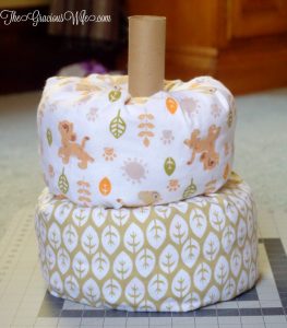 DIY Lion King Faux Fondant Diaper Cake - an adorable DIY addition to a baby shower for a baby boy or a baby girl. And you can use the crafts supplies to decorate the nursery after the baby shower! From TheGraciousWife.com