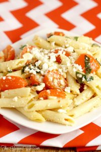 This Easy Feta Pasta Salad Recipe with Italian dressing uses just 5 ingredients and is made in just 30 minutes! A perfect salad side dish recipe idea for a picnic, party, or BBQ all Spring and Summer long.  Creamy feta, juicy tomatoes, and fresh basil make this dish amazing! So easy but oh-so-good.