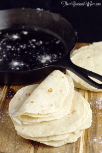 Homemade flour tortillas - frugal and way more delicious than store-bought tortillas. Warm, soft tortillas perfect for your next taco or burrito dinner night. | cooking tips