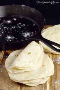 Homemade flour tortillas - frugal and way more delicious than store-bought tortillas. Warm, soft tortillas perfect for your next taco or burrito dinner night.  | cooking tips 