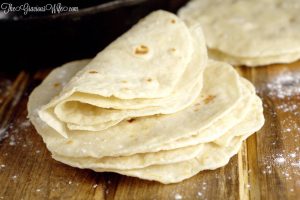 Homemade flour tortillas - frugal and way more delicious than store-bought tortillas. Warm, soft tortillas perfect for your next taco or burrito dinner night.  | cooking tips 