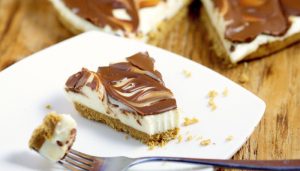 Easy No Bake Smores Cheesecake recipe - a quick and easy no bake smores dessert recipe that can be made from scratch in just 10 minutes! From TheGraciousWife.com
