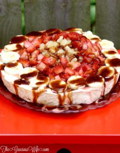Banana Split Ice Cream Pie Recipe - a no bake pie recipe with graham pie crust, banana swirl ice cream, topped with pineapple, strawberries, chocolate sauce, whipped cream, and of course a cherry! This is so good.  It's seriously the perfect summer treat.