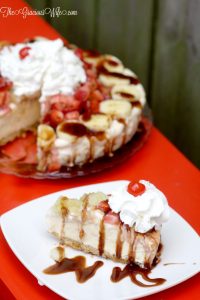Banana Split Ice Cream Pie Recipe - a no bake pie recipe with graham pie crust, banana swirl ice cream, topped with pineapple, strawberries, chocolate sauce, whipped cream, and of course a cherry! This is so good. It's seriously the perfect summer treat.