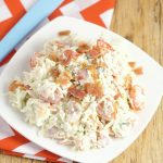 Creamy Coleslaw Recipe with Bacon - an easy Summer salad and side dish recipe combines classic cabbage and coleslaw dressing with the bold flavors of cherry tomatoes, bacon, and blue cheese to make a delicious and refreshing side dish for every picnic or cookout!