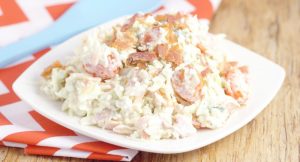 Creamy Coleslaw Recipe with Bacon - an easy Summer salad and side dish recipe combines classic cabbage and coleslaw dressing with the bold flavors of cherry tomatoes, bacon, and blue cheese to make a delicious and refreshing side dish for every picnic or cookout!