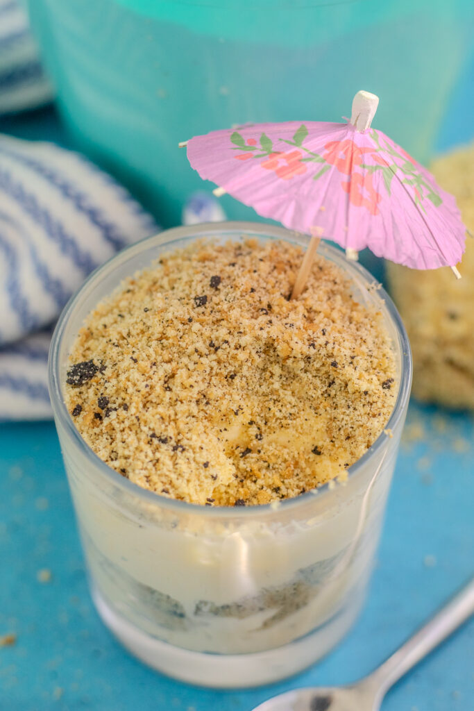 Overhead view of sand pudding in a small glass with scoop missing.