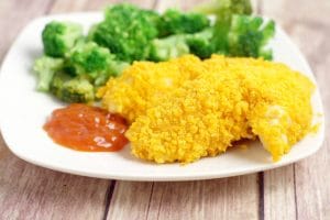 Cheesy Cheez It Chicken Tenders - an easy dinner recipe idea that the kids will love and you will too.  Chicken covered in cheese and Cheez-its and baked until crispy. Mmmm.... Cheese!