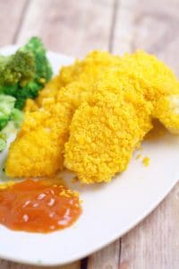 Cheesy Cheez It Chicken Tenders - an easy dinner recipe idea that the kids will love and you will too.  Chicken covered in cheese and Cheez-its and baked until crispy. Mmmm.... Cheese!