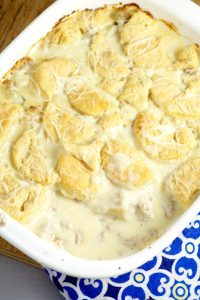 Biscuits and Gravy Casserole with homemade flaky and fluffy buttermilk biscuits smothered in rich and creamy sausage gravy for a classic family breakfast recipe or dinner recipe. Can't go wrong with a comfort food classic!