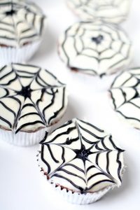 Spiderweb Cupcakes are a cute and fun but totally easy treat, perfect for Halloween or an adorable Spiderman birthday party.  They'll be a hit at your next party! Such a cute treat for kids!