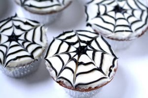 Spiderweb Cupcakes are a cute and fun but totally easy treat, perfect for Halloween or an adorable Spiderman birthday party.  They'll be a hit at your next party! Such a cute treat for kids!