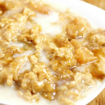 Overnight Crockpot Apple Oatmeal recipe with tangy apples, nutty oats, and sweet butter and powdered sugar glaze is a perfect overnight make ahead breakfast recipe for Fall and the holidays.