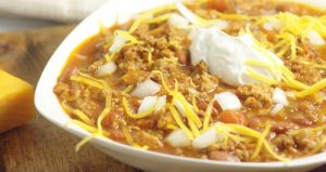 Crockpot Beef Chili made with a classic ground beef chili recipe, simmered to comfort food perfection in the slow cooker. Top with your favorites like cheese, onions, or crackers. Delicious, amazing chili, the easy way. Mmm... This looks so good!